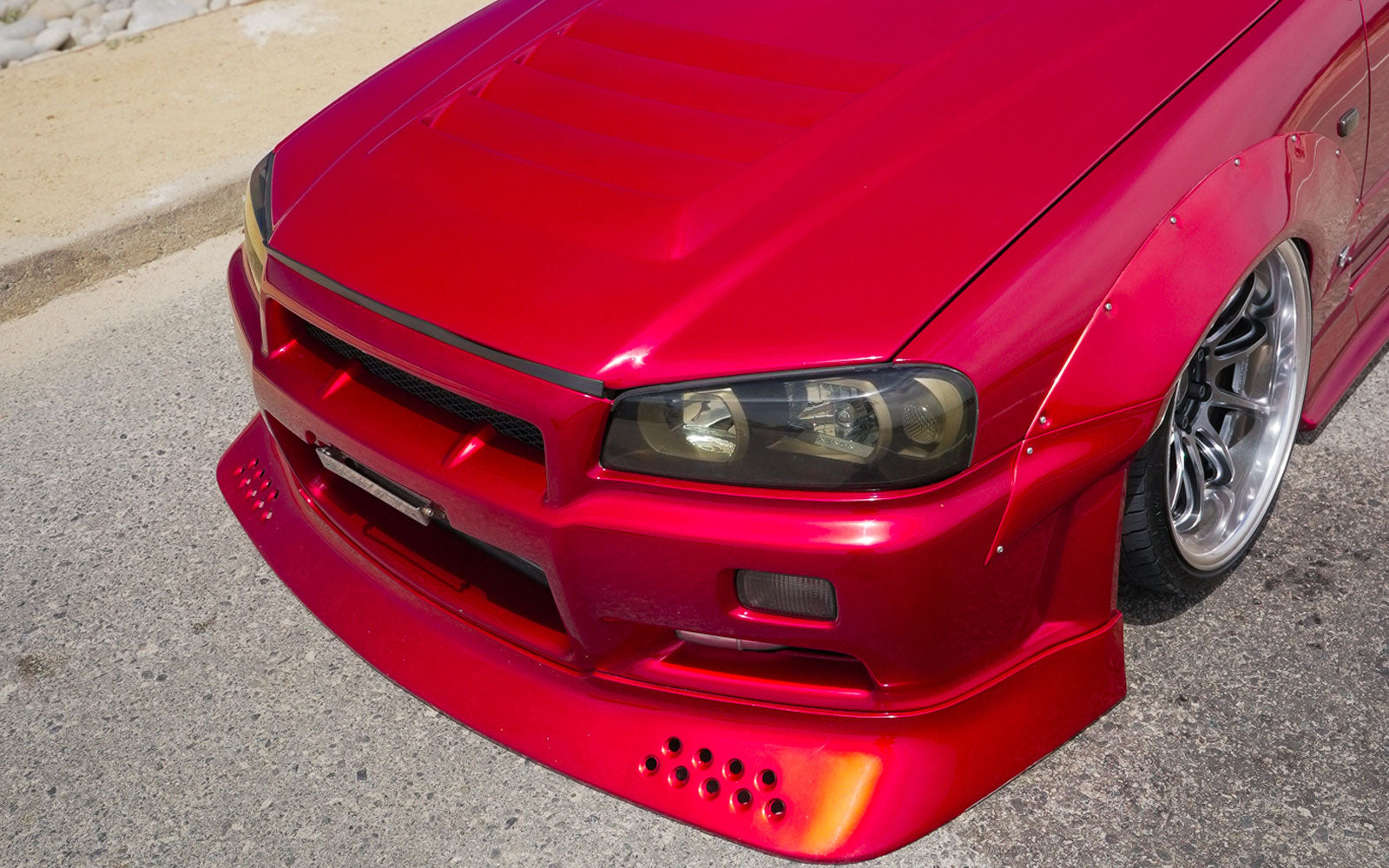 Rear three-quarter view of the EK Hatch giveaway car